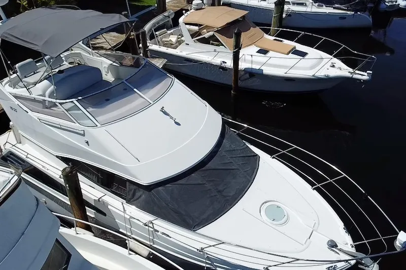 Slide: The Image of 2006 Carver 33 Super Sport yacht docked at marina, aerial view. - 4