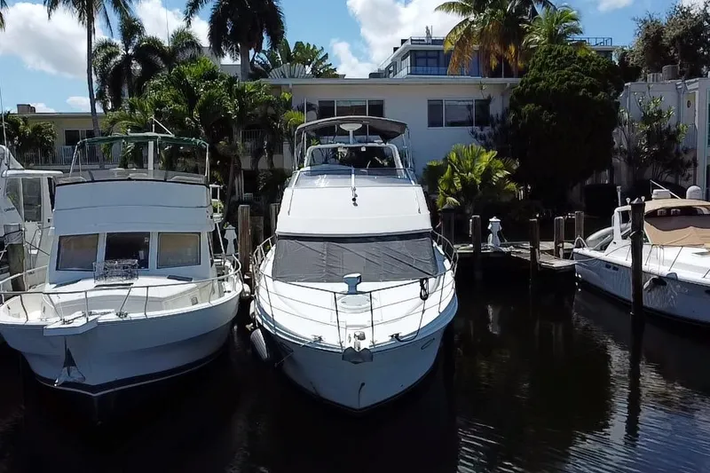 Slide: The Image of 2006 Carver 33 Super Sport yacht docked at marina, aerial view. - 2