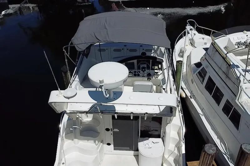 Slide: The Image of 2006 Carver 33 Super Sport yacht docked, aerial view showing cockpit and helm. - 32