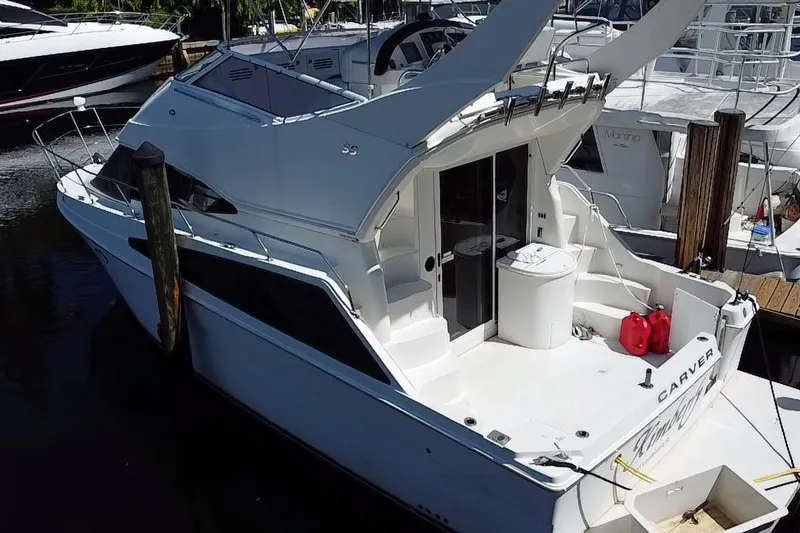 Slide: The Image of 2006 Carver 33 Super Sport yacht docked at marina, rear view. - 34