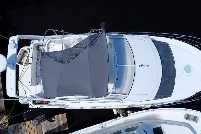 Slide: The Image of Top view of a 2006 Carver 33 Super Sport yacht docked at a marina. - 36