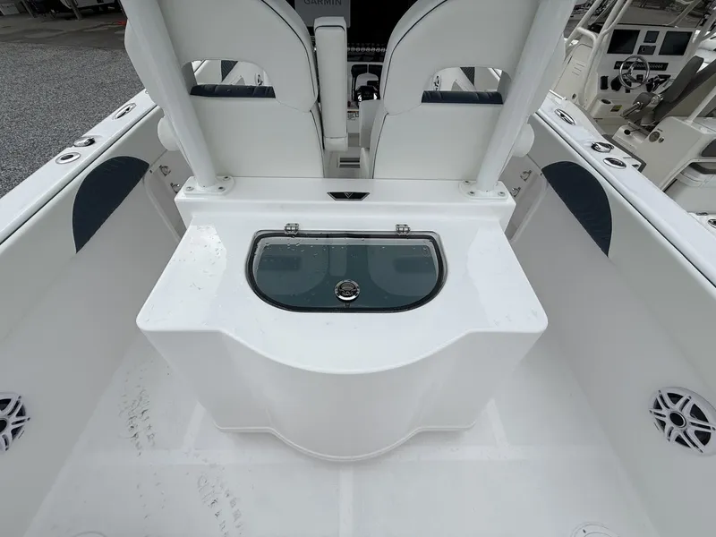 Slide: The Image of 2026 Twin Vee GFX2 260 boat interior with seating and storage compartment. - 12