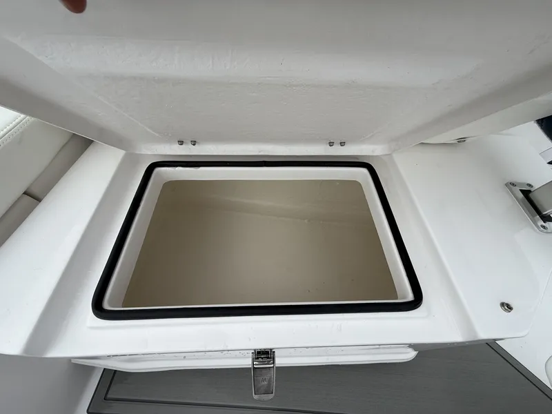 Slide: The Image of Open storage compartment on 2026 Twin Vee GFX2 260 GFX2 boat. - 16