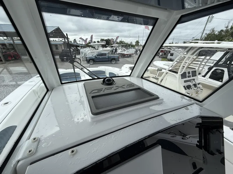 Slide: The Image of 2026 Twin Vee GFX2 260 boat interior with dashboard view, showcasing sleek design. - 19