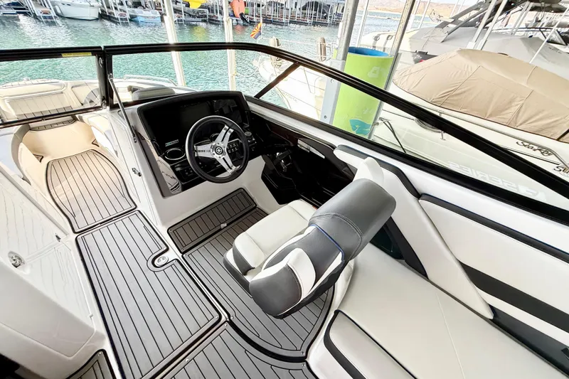 Slide: The Image of 2018 Yamaha Boats 242 Limited S E-Series interior with sleek design and modern controls. - 20