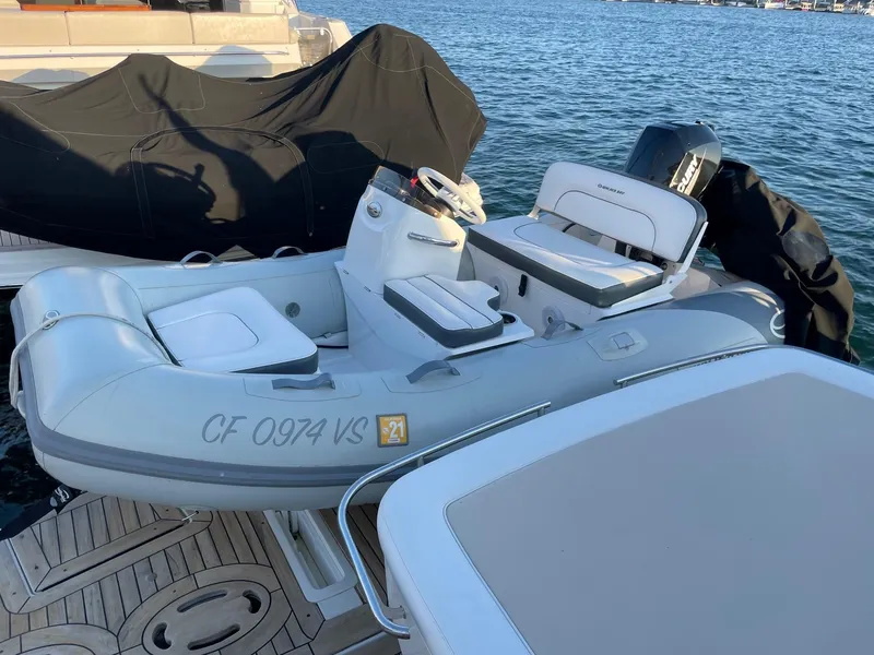 Slide: The Image of Inflatable boat docked beside a 2012 Sea Ray 450 Sundancer yacht. - 3