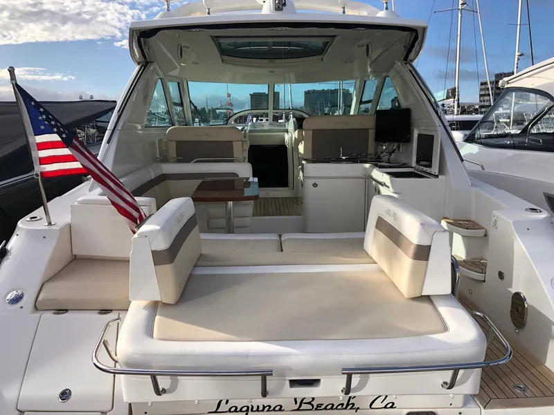 Slide: The Image of 2012 Sea Ray 450 Sundancer yacht with seating area, docked in Laguna Beach, CA. - 4
