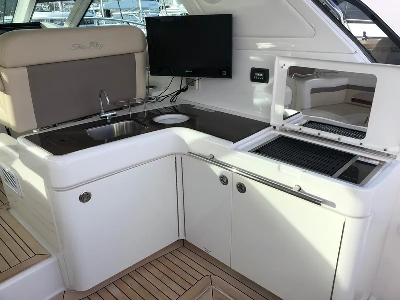 Slide: The Image of Cockpit BBQ, Sink, Refrigerator, Cooler, Storage - 8