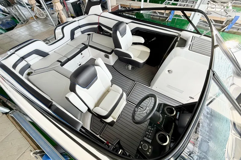 Slide: The Image of 2018 Yamaha Boats 242 Limited S E-Series interior with sleek seating and modern dashboard. - 11