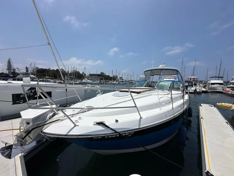 Slide: The Image of 2020 Monterey 355 Sport Yacht docked at a marina under a clear blue sky. - 10
