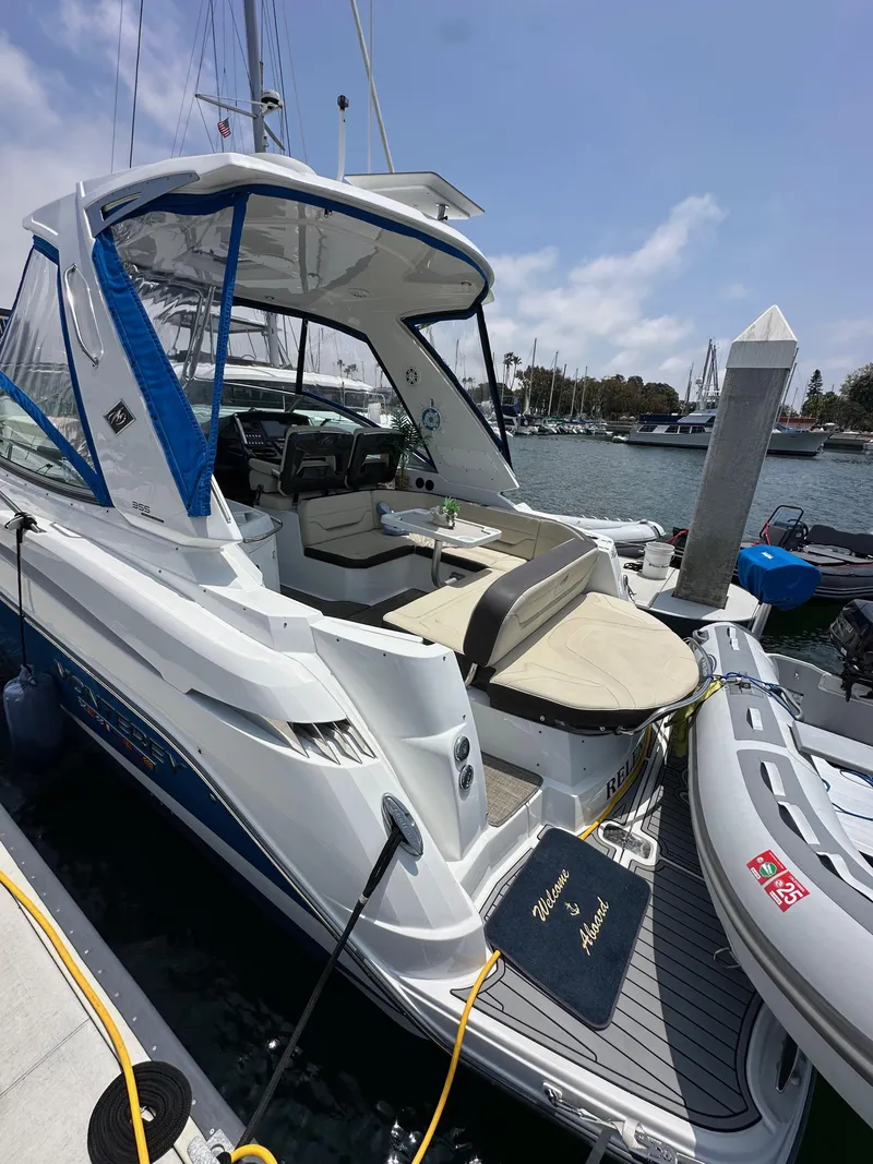 Slide: The Image of 2020 Monterey 355 Sport Yacht docked at marina, featuring sleek design and spacious seating. - 16