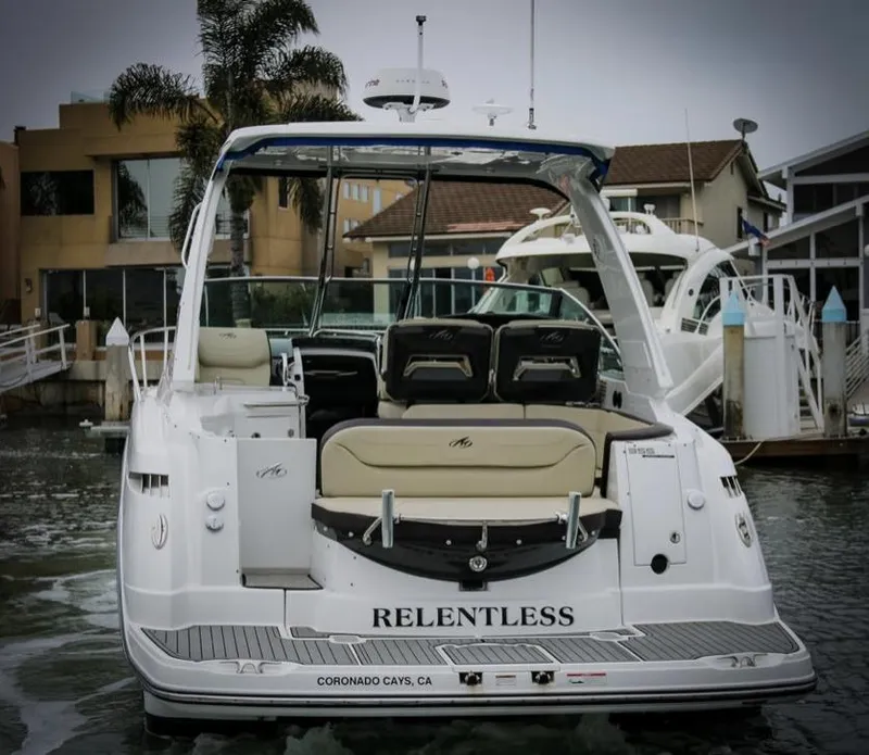 Slide: The Image of 2020 Monterey 355 Sport Yacht docked, rear view, named "Relentless" in Coronado Cays, CA. - 19
