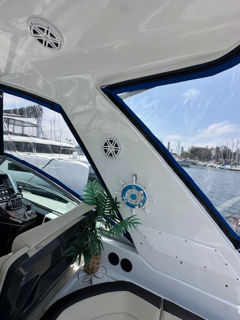 Slide: The Image of Interior view of 2020 Monterey 355 Sport Yacht with marina backdrop. - 26