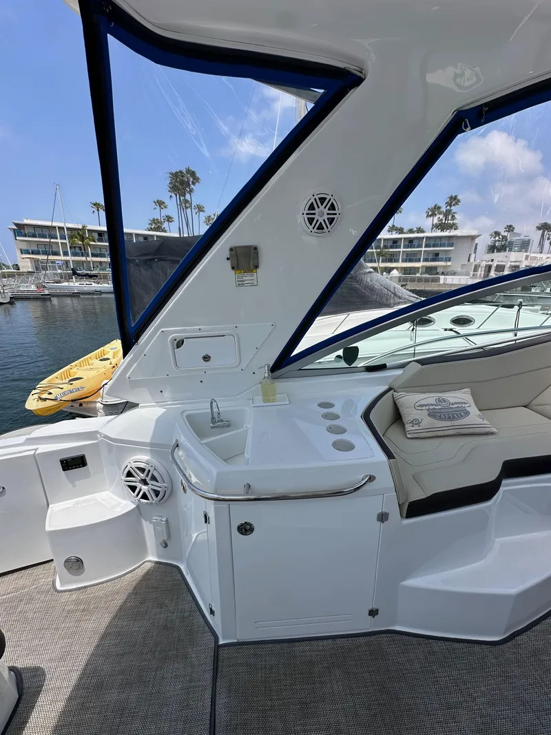 Slide: The Image of 2020 Monterey 355 Sport Yacht interior with seating and waterfront view. - 27