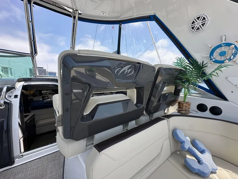 Slide: The Image of Interior of 2020 Monterey 355 Sport Yacht with plush seating and nautical decor. - 31