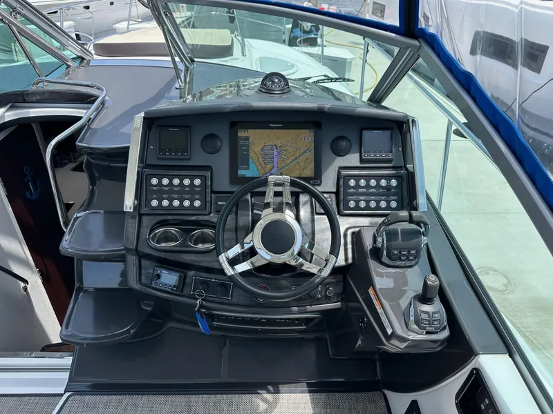Slide: The Image of 2020 Monterey 355 Sport Yacht helm with navigation system and controls. - 34