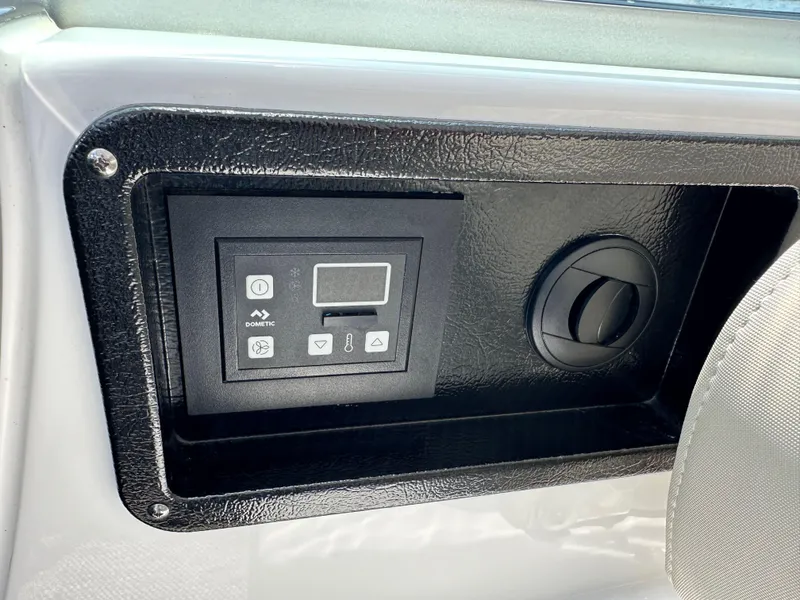 Slide: The Image of Control panel on 2020 Monterey 355 Sport Yacht dashboard, featuring digital display and buttons. - 35