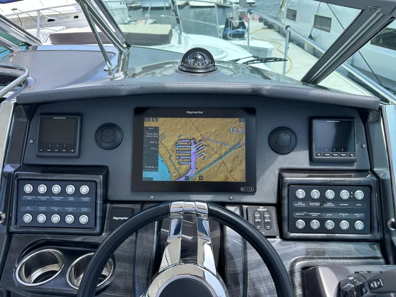 Slide: The Image of Dashboard of a 2020 Monterey 355 Sport Yacht with navigation and control panels. - 37