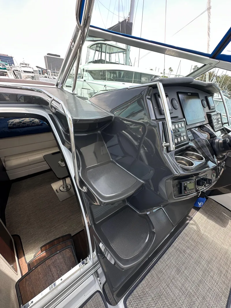 Slide: The Image of 2020 Monterey 355 Sport Yacht cockpit with modern navigation controls and seating. - 38