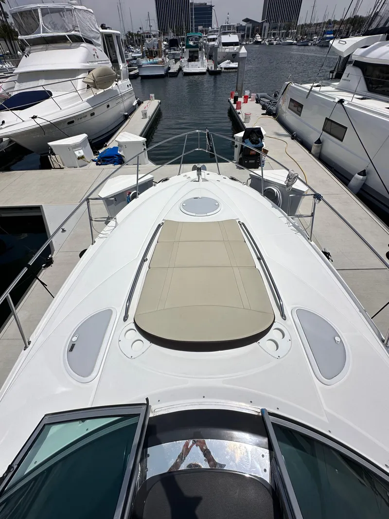 Slide: The Image of 2020 Monterey 355 Sport Yacht docked at marina, featuring spacious sunbathing deck. - 41