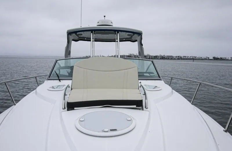 Slide: The Image of 2020 Monterey 355 Sport Yacht on calm water, featuring sleek design and spacious deck. - 43