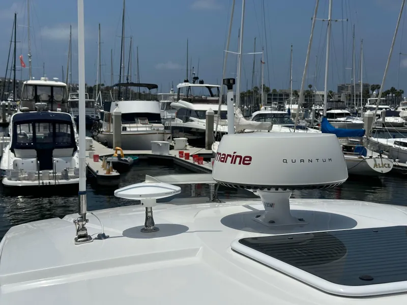Slide: The Image of 2020 Monterey 355 Sport Yacht docked in a marina with other boats. - 44