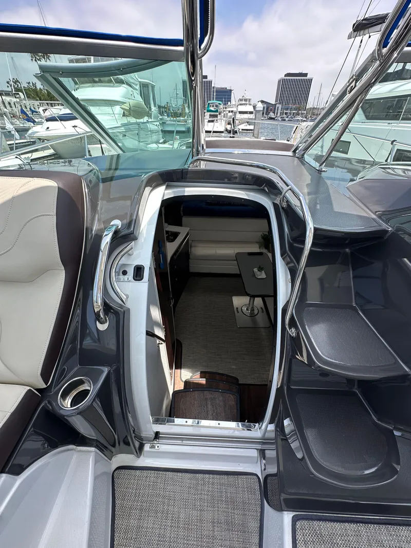 Slide: The Image of 2020 Monterey 355 Sport Yacht interior view with seating and cabin access. - 46