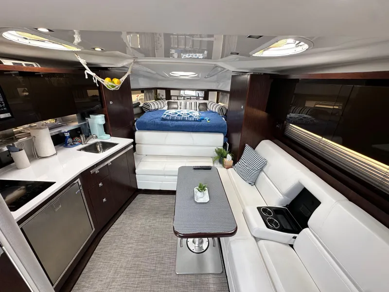 Slide: The Image of Luxurious interior of 2020 Monterey 355 Sport Yacht with modern kitchen and cozy seating area. - 48