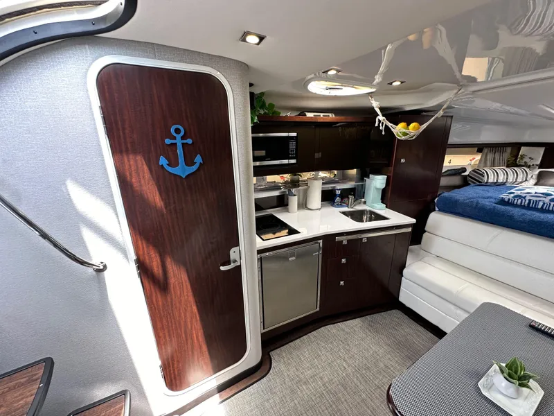 Slide: The Image of Interior of 2020 Monterey 355 Sport Yacht with kitchenette and cozy seating area. - 49