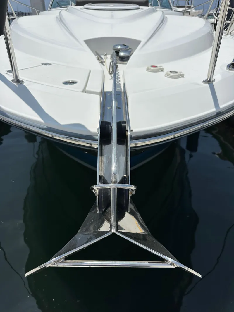 Slide: The Image of 2020 Monterey 355 Sport Yacht bow with anchor, docked on calm water. - 8