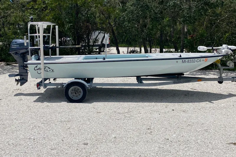 Slide: The Image of 2019 Cayo Boatworks 173 on trailer, parked outdoors with Yamaha outboard motor. - 1