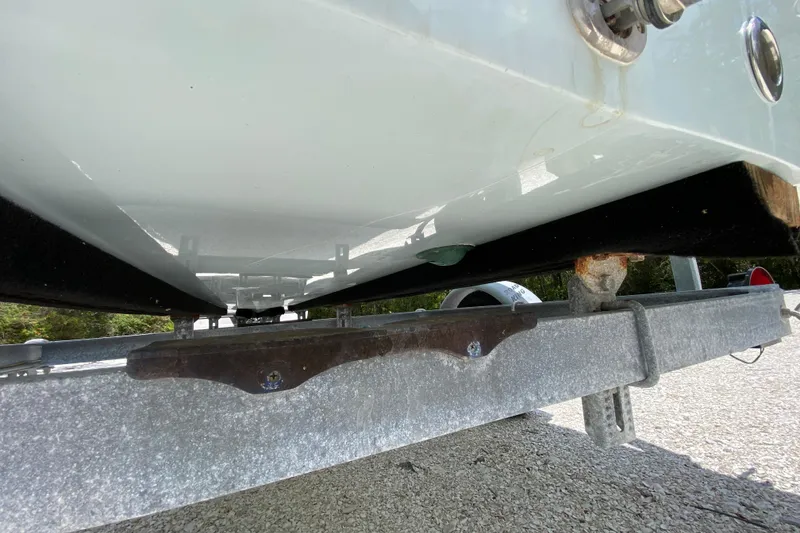 Slide: The Image of 2019 Cayo Boatworks 173 on trailer, underside view showing hull and trailer details. - 12