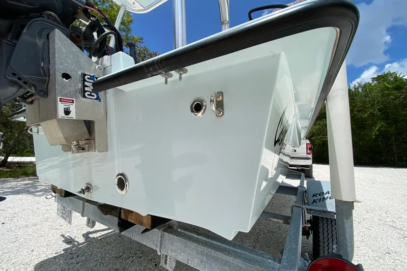 Slide: The Image of 2019 Cayo Boatworks 173 on trailer, showcasing sleek hull design under clear blue sky. - 13