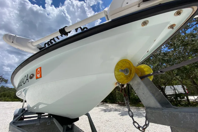 Slide: The Image of 2019 Cayo Boatworks 173 on trailer under cloudy sky, showcasing hull and bow details. - 16