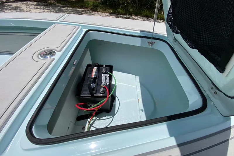 Slide: The Image of Open storage compartment with battery in 2019 Cayo Boatworks 173. - 26