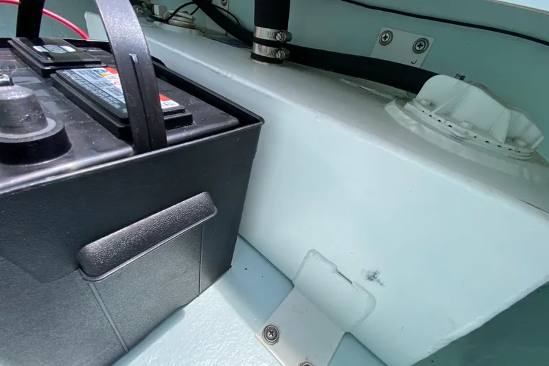 Slide: The Image of Battery compartment of 2019 Cayo Boatworks 173, featuring wiring and secure installation. - 28