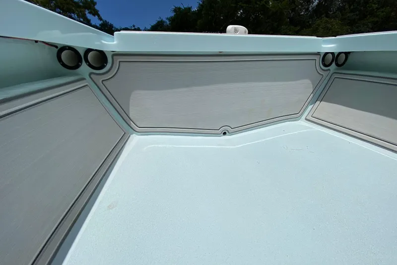 Slide: The Image of 2019 Cayo Boatworks 173 interior with light blue deck and storage compartments. - 30