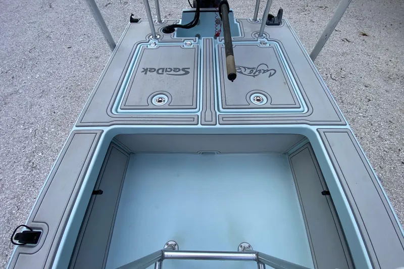 Slide: The Image of 2019 Cayo Boatworks 173 deck with SeaDek flooring, featuring storage compartments. - 38