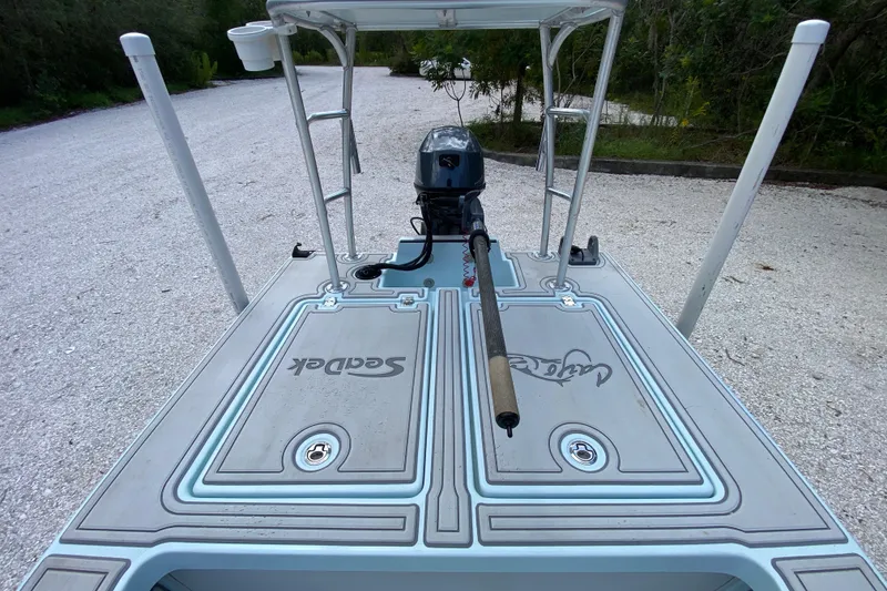Slide: The Image of 2019 Cayo Boatworks 173 with Seadek flooring, parked on gravel path. - 39