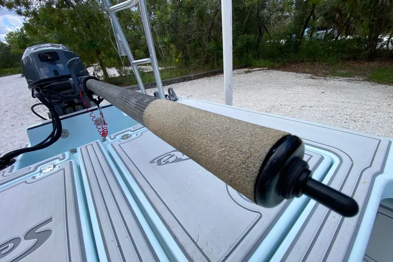 Slide: The Image of 2019 Cayo Boatworks 173 with motor and deck, parked on gravel near trees. - 40