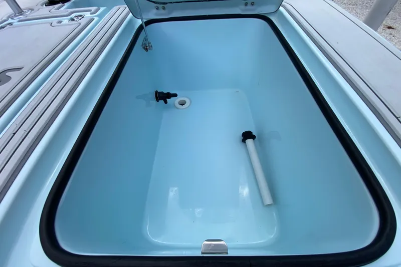 Slide: The Image of Open storage compartment of 2019 Cayo Boatworks 173, featuring drainage and clean interior. - 45