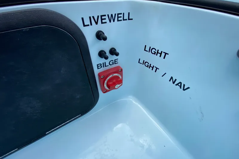 Slide: The Image of Control panel of 2019 Cayo Boatworks 173 with switches for livewell, bilge, and lights. - 49