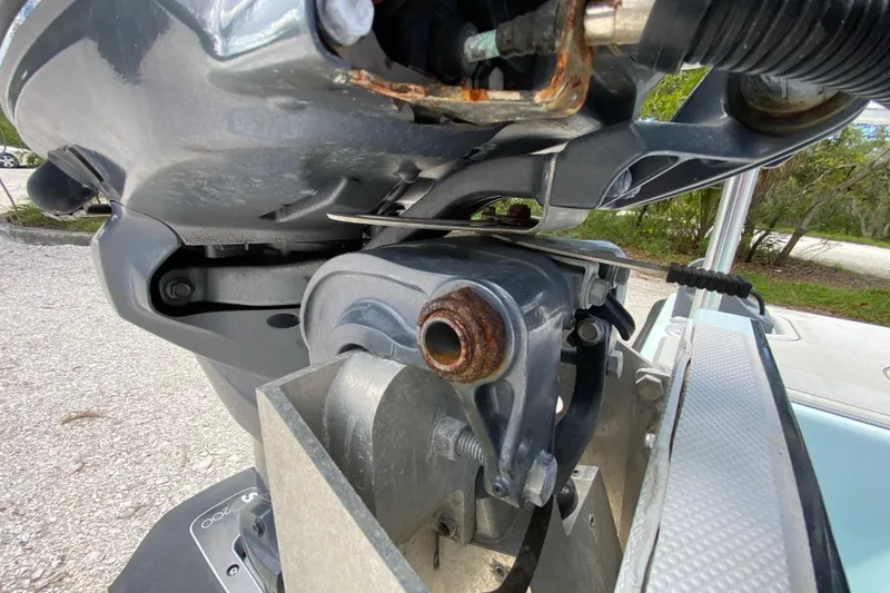 Slide: The Image of Close-up of a 2019 Cayo Boatworks 173 engine component with visible rust. - 54