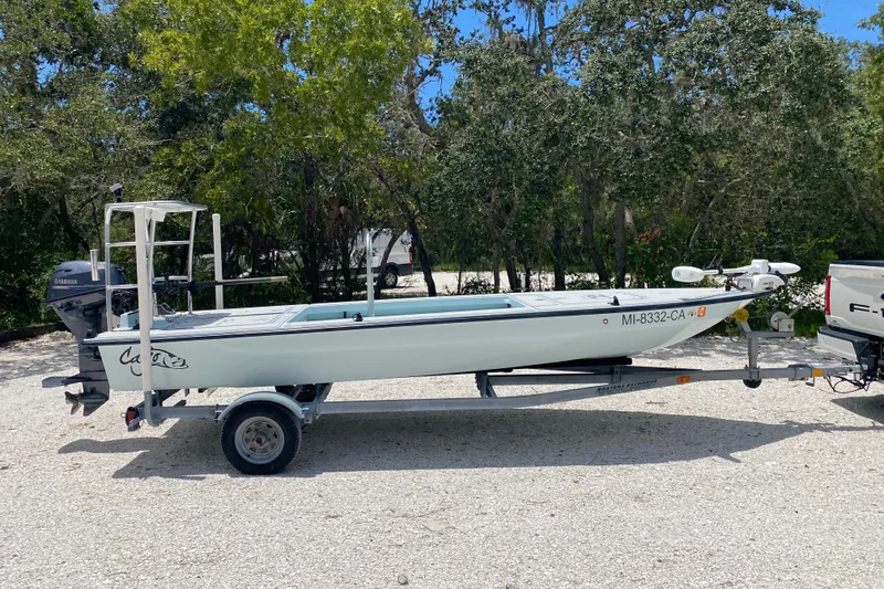 Slide: The Image of 2019 Cayo Boatworks 173 on trailer, parked outdoors with trees in background. - 6