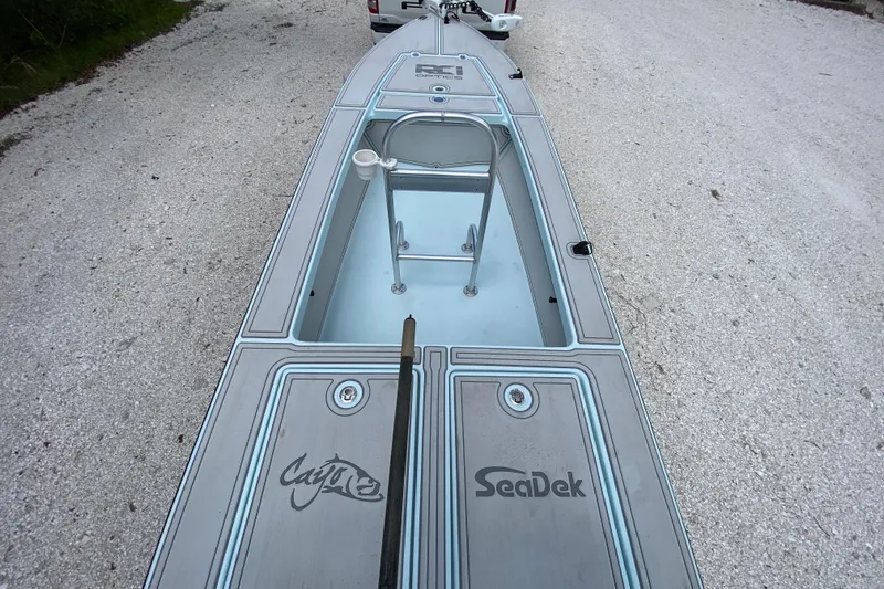 Slide: The Image of 2019 Cayo Boatworks 173 with SeaDek flooring on a gravel path. - 60