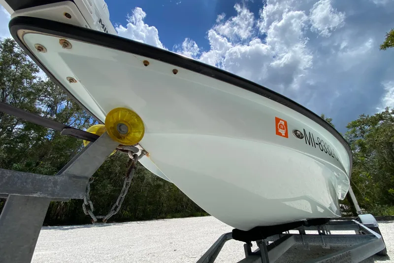 Slide: The Image of 2019 Cayo Boatworks 173 on trailer under cloudy sky, side view. - 8