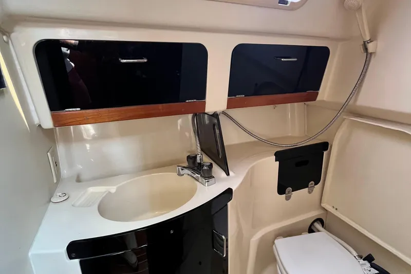 Slide: The Image of Interior of 1995 Hunter 29.5 sailboat bathroom with sink, storage, and toilet. - 39