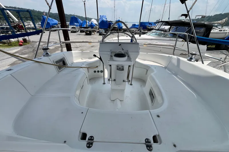 Slide: The Image of Cockpit view of a 1995 Hunter 29.5 sailboat in a marina setting. - 9
