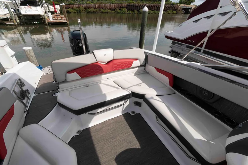 Slide: The Image of 2022 Four Winns HD8 boat interior with stylish seating and modern design. - 7