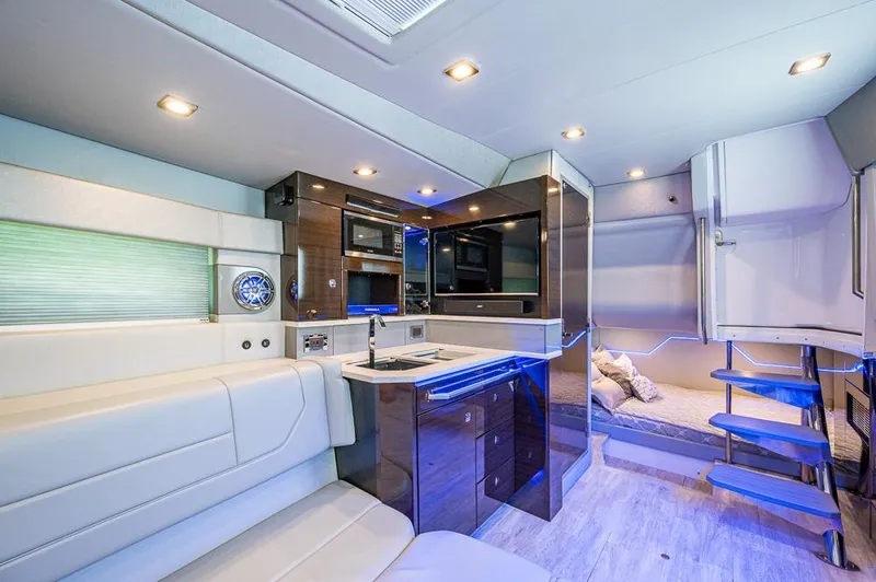 Slide: The Image of Luxurious interior of 2019 Formula 430 Super Sport Crossover with modern kitchen and seating area. - 14